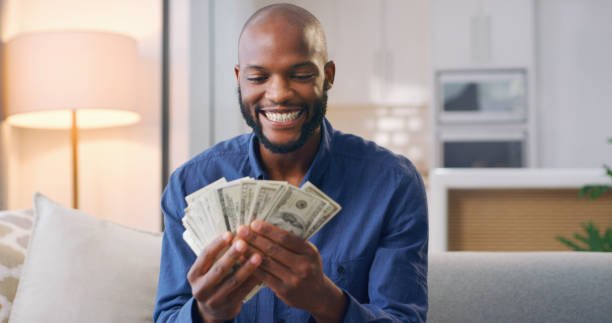 man holding cash