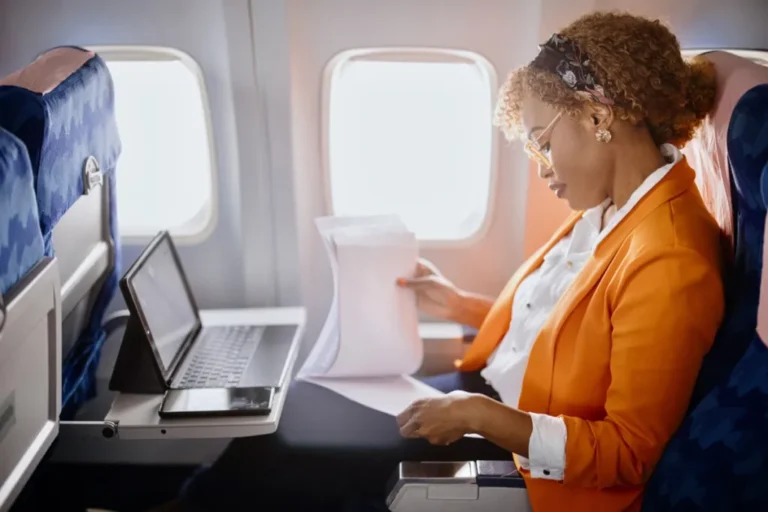 woman-working-in-business-section-plane